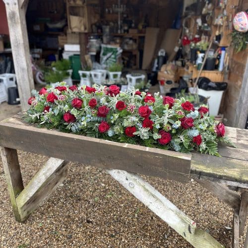 Deep red casket spray FEB25